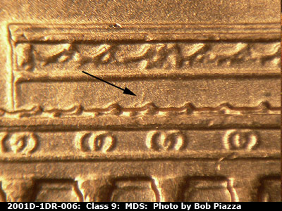 Die-stage B marker on 2001D•1DR•006 (2001 Doubled Die Reverse).