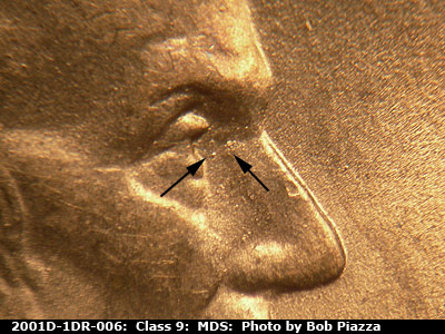 Die-stage B marker on 2001D•1DR•006 (2001 Doubled Die Reverse).