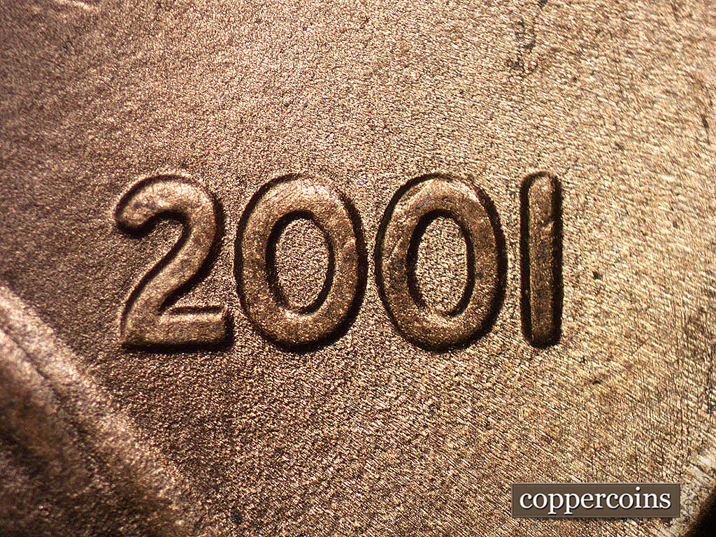 Die-stage B marker on 2001P•1DO•001 showing Moderate extra thickness on date.