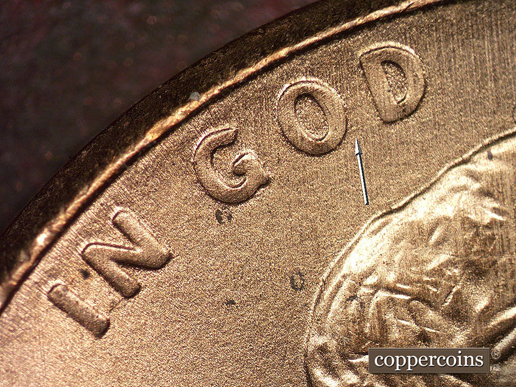 Die-stage B marker on 2001P•1DO•001 showing Light die scratches nder OD in GOD.