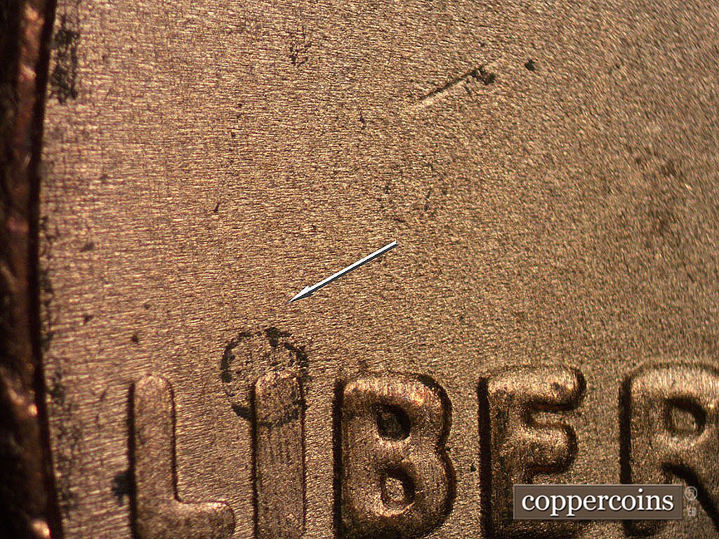 Die-stage B marker on 2001P•1DO•001 showing Worn but still visible N/S die scratch from top of I in LIBERTY.