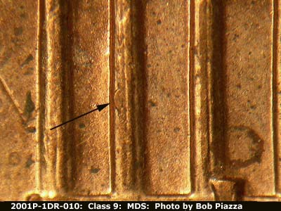 Die-stage B marker on 2001P•1DR•010 (2001 Doubled Die Reverse).