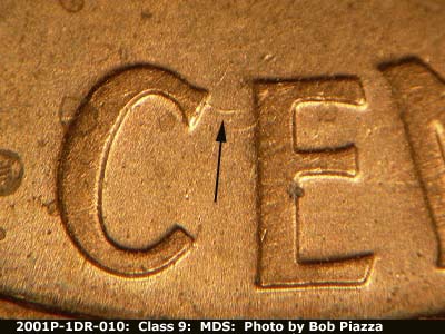 Die-stage B marker on 2001P•1DR•010 (2001 Doubled Die Reverse).