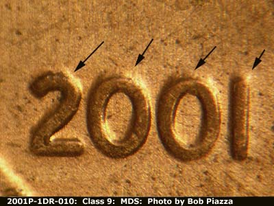 Die-stage B marker on 2001P•1DR•010 (2001 Doubled Die Reverse).
