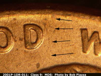 Die-stage B marker on 2001P•1DR•011 (2001 Doubled Die Reverse).
