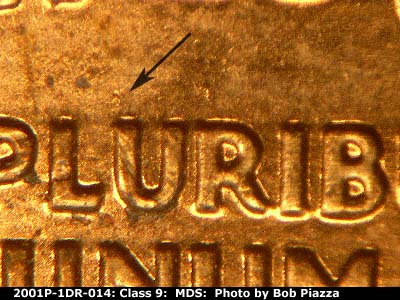 Die-stage B marker on 2001P•1DR•014 (2001 Doubled Die Reverse).