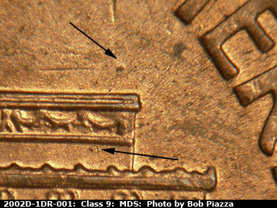Die-stage B marker on 2002D•1DR•001 (2002 Doubled Die Reverse).