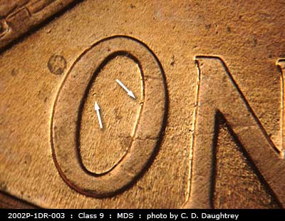 Die-stage B marker on 2002P•1DR•003 (2002 Doubled Die Reverse).