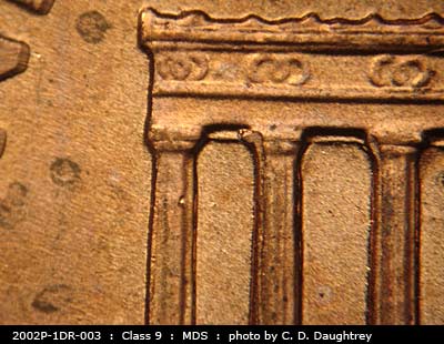 Die-stage B marker on 2002P•1DR•003 (2002 Doubled Die Reverse).