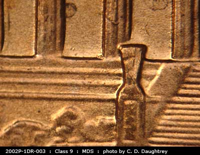 Die-stage B marker on 2002P•1DR•003 (2002 Doubled Die Reverse).