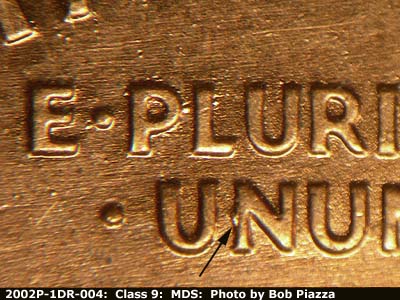 Die-stage B marker on 2002P•1DR•004 (2002 Doubled Die Reverse).