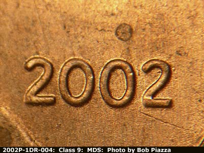 Die-stage B marker on 2002P•1DR•004 (2002 Doubled Die Reverse).