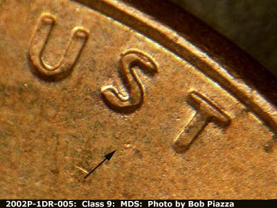 Die-stage B marker on 2002P•1DR•005 (2002 Doubled Die Reverse).