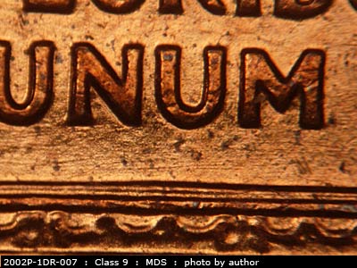 Die-stage B marker on 2002P•1DR•007 (2002 Doubled Die Reverse).