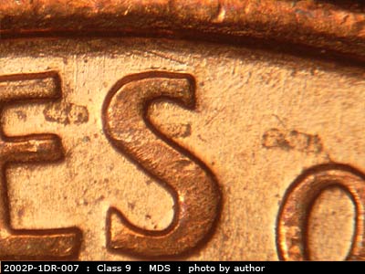 Die-stage B marker on 2002P•1DR•007 (2002 Doubled Die Reverse).