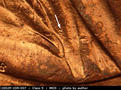 Die-stage B marker on 2002P•1DR•007 (2002 Doubled Die Reverse).
