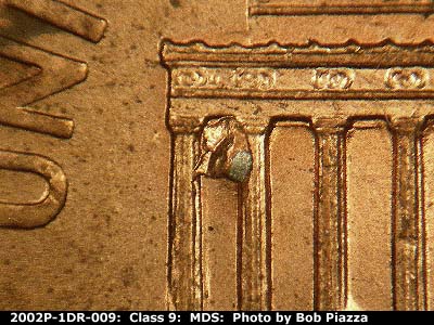 Die-stage B marker on 2002P•1DR•009 (2002 Doubled Die Reverse).