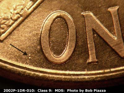 Die-stage B marker on 2002P•1DR•010 (2002 Doubled Die Reverse).