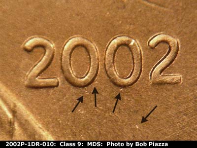 Die-stage B marker on 2002P•1DR•010 (2002 Doubled Die Reverse).