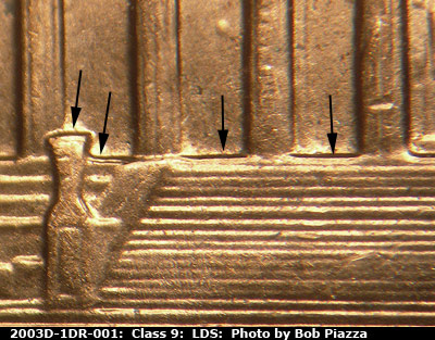 Die-stage C marker on 2003D•1DR•001 (2003 Doubled Die Reverse).
