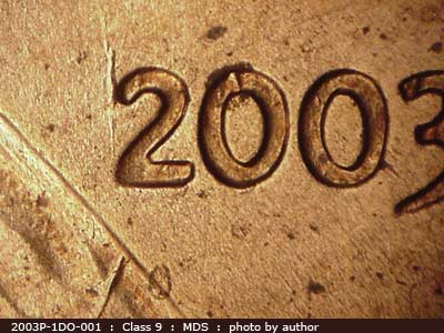 Die-stage B marker on 2003P•1DO•001 (2003 Doubled Die Obverse).