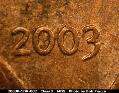 Die-stage B marker on 2003P•1DR•002 (2003 Doubled Die Reverse).