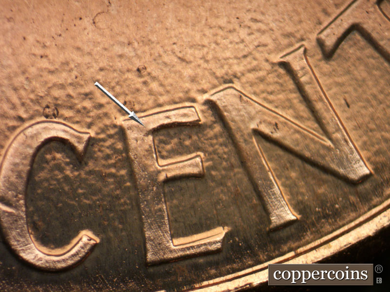 Die-stage B marker on 2003P•1DR•004 (2003 Doubled Die Reverse).