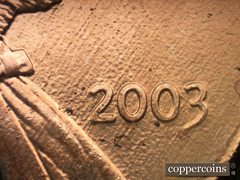 Die-stage B marker on 2003P•1DR•004 (2003 Doubled Die Reverse).