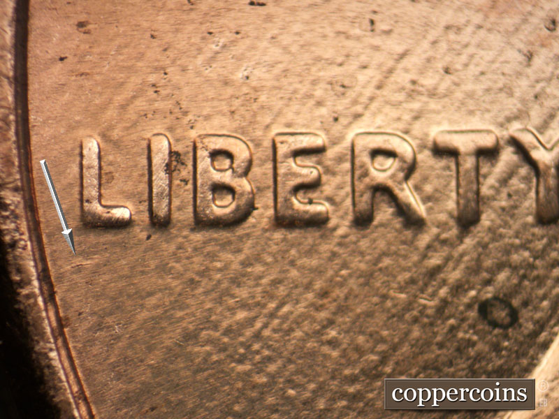 Die-stage B marker on 2003P•1DR•004 (2003 Doubled Die Reverse).