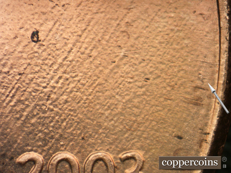 Die-stage B marker on 2003P•1DR•004 (2003 Doubled Die Reverse).