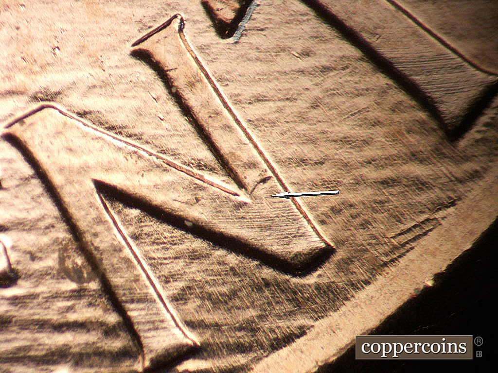 Die-stage B marker on 2003P•1DR•005 showing Die gouge on N in CENT.