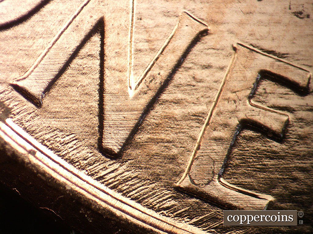 Die-stage B marker on 2003P•1DR•005 showing Short NE die scratching from rim under ONE.