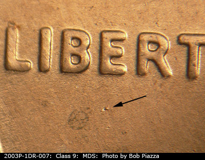 Die-stage B marker on 2003P•1DR•007 (2003 Doubled Die Reverse).