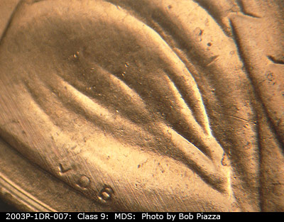 Die-stage B marker on 2003P•1DR•007 (2003 Doubled Die Reverse).