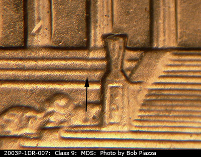 Die-stage B marker on 2003P•1DR•007 (2003 Doubled Die Reverse).