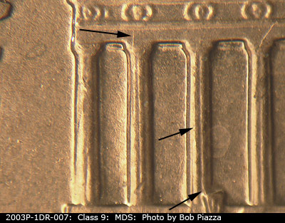 Die-stage B marker on 2003P•1DR•007 (2003 Doubled Die Reverse).