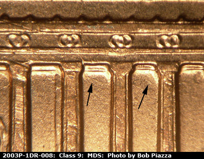 Die-stage B marker on 2003P•1DR•008 (2003 Doubled Die Reverse).