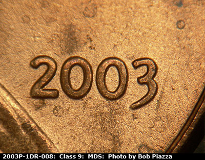 Die-stage B marker on 2003P•1DR•008 (2003 Doubled Die Reverse).