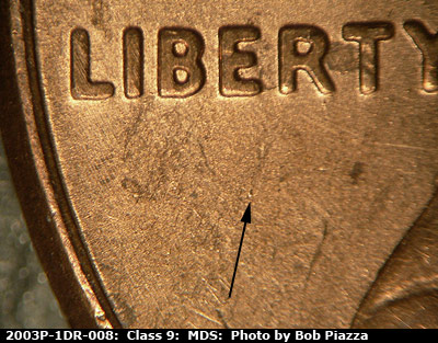 Die-stage B marker on 2003P•1DR•008 (2003 Doubled Die Reverse).