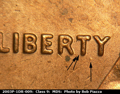 Die-stage B marker on 2003P•1DR•009 (2003 Doubled Die Reverse).