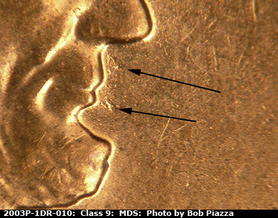Die-stage B marker on 2003P•1DR•010 (2003 Doubled Die Reverse).