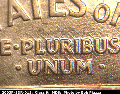 Die-stage B marker on 2003P•1DR•011 (2003 Doubled Die Reverse).
