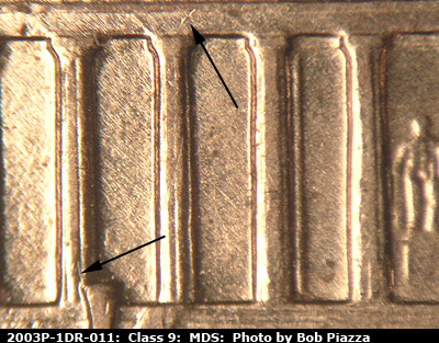 Die-stage B marker on 2003P•1DR•011 (2003 Doubled Die Reverse).