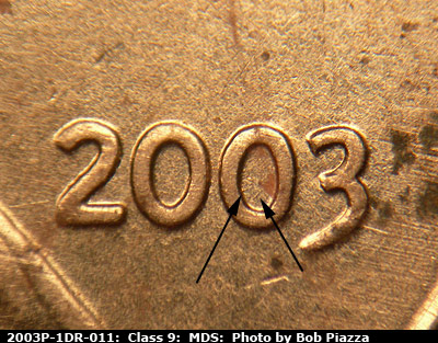 Die-stage B marker on 2003P•1DR•011 (2003 Doubled Die Reverse).