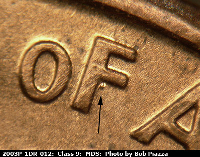 Die-stage B marker on 2003P•1DR•012 (2003 Doubled Die Reverse).