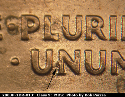 Die-stage B marker on 2003P•1DR•013 (2003 Doubled Die Reverse).