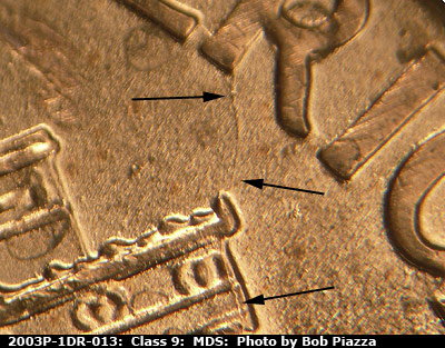 Die-stage B marker on 2003P•1DR•013 (2003 Doubled Die Reverse).