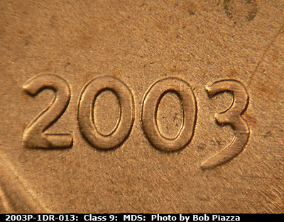 Die-stage B marker on 2003P•1DR•013 (2003 Doubled Die Reverse).