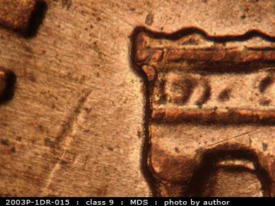 Die-stage B marker on 2003P•1DR•015 (2003 Doubled Die Reverse).