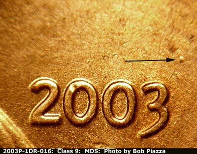 Die-stage B marker on 2003P•1DR•016 (2003 Doubled Die Reverse).